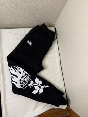 Broken promises Black Sweatpants with White Flame Rose Graphic